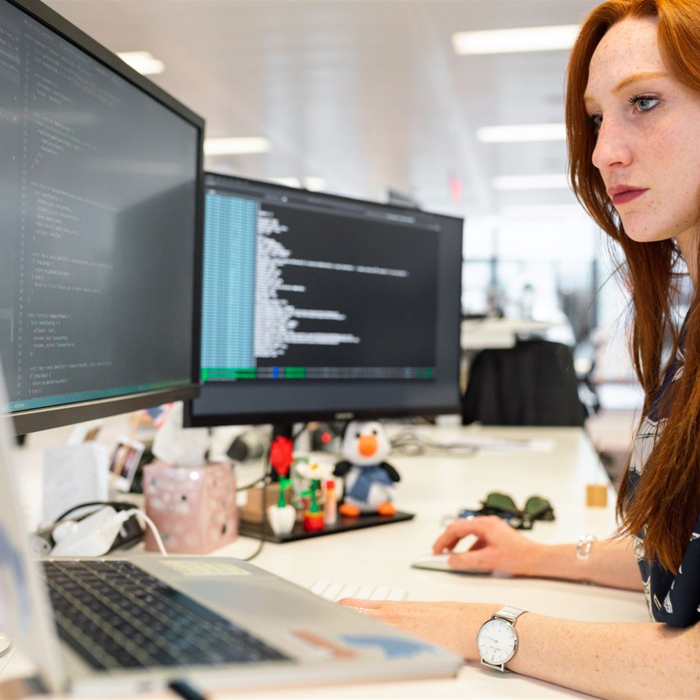 Trader working at a dual-monitor workstation